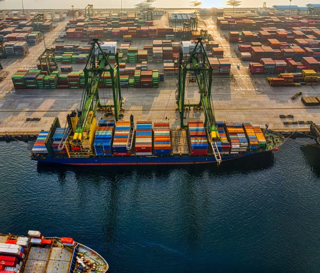 pexels-photo-3856433-3856433 Aerial shot of colorful shipping containers at North Jakarta's bustling port, Indonesia.